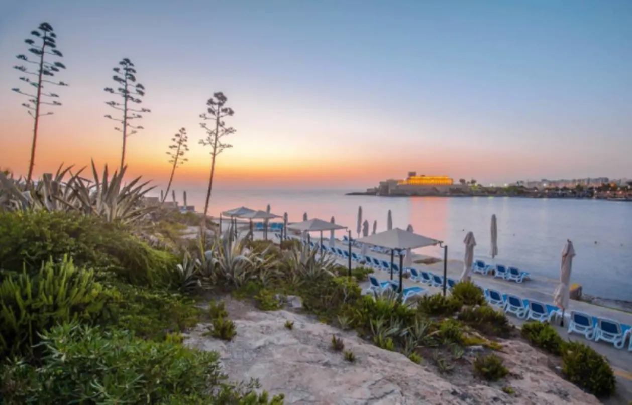 Corinthia St Georges Bay beach at sunset